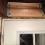 Deficiency: Unsupported header over door opening. Although no signs of settlement are evident at the time of inspection, this may settle over time.